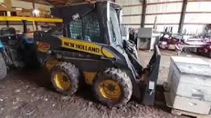From inside the cab, you can lock and unlock the . How To Change The Bucket On A New Holland 175l Youtube