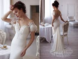 Angelic Lace Wedding Gown Feathers Slinky Silhouette Pearl Buttons Open Back Goddess Dress Long Train Bare Shoulders Serenite Skinny Wedding Dress Wedding Gowns Lace Wedding Dresses Lace