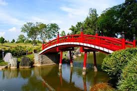 Red Gardens In Japan Iconic Red Bridge In Japanese Garden Japanese Garden Japanese Garden Bridge Japanese Garden Design