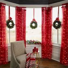 Ultimate Window Decoration For Christmas With Red Curtains Candles Lights And Wrea Christmas Window Decorations Indoor Christmas Decorations Indoor Christmas
