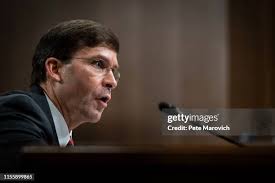 As his family looks on, Secretary of Defense nominee, Mark Esper,... News  Photo