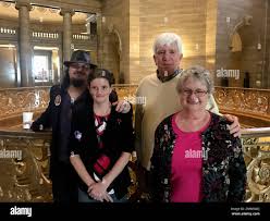 Jeff Barfield, Stacey Owens, Regina Wood and Jim Wood, left to right, pose  for a photo in the rotunda of the Missouri Capitol in Jefferson City
