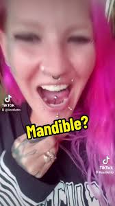 Replying to @jag #mandiblepiercing #transmandiblepiercing #transmandib...