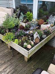 This Raised Bed Fairy Garden Is So Darn Cute Source By Ann Baker Fb Share 6 7 18 On Mandy Fairy Herb Garden Fairy Garden Fairy Garden Box