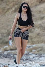 Kourtney kardashian spends memorial day with throughout her first trimester, the star seems to be opting for comfortable athleisure outfits, like this band tee and spandex gym shorts she wore leaving. Shorts Kylie Jenner Top Summer Outfits Sneakers Crop Tops Bandana Print Shoes Jewels Kardashians Black And White Shorts Jewelry Body Chain Gold Body Chain Kylie Jenner Jewelry Keeping Up With The Kardashians