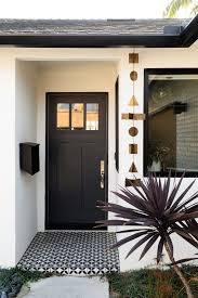 Once all wood glue and primer layers are completely dry, and once if the paint job looks good to you and you are using a one and done type of paint, feel free to move on to the next step; Before After A Neglected 1960s Ranch Style Home Gets A Sunny Outdoor Connection Exterior House Colors House Exterior Modern Front Door