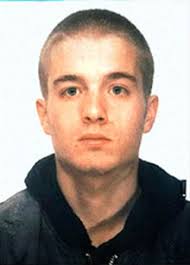 First he leans down to pick up a fire extinguisher from the ground, while looking at the officers beneath the rear window of the truck; Carlo Giuliani 1978 2001 Find A Grave Memorial