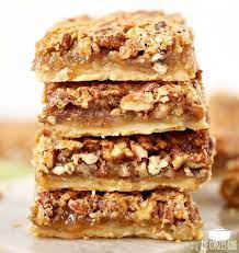 These pecan bars are made with a simple shortbread crust instead of a pie crust, so they're even easier than a traditional pie. Southern Pecan Pie Bars With Shortbread Crust