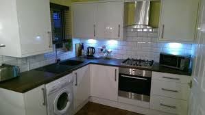 We've got white units and dark wood worktops. Kitchens