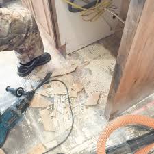 How To Remove Tile Flooring Yourself With Tips And Tricks Removing Floor Tiles Tile Floor Flooring