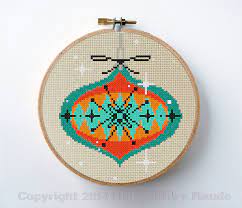 Christmas comes even earlier for cross stitchers, so get a quick start with our christmas cross stitch patterns. Christmas Ornament Cross Stitch Pattern Mid Century Modern Etsy Cross Stitch Patterns Christmas Christmas Cross Stitch Mid Century Modern Christmas