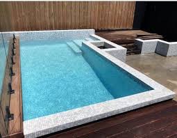 The pool gives a catchy style to the decor of the area with its modern design. Top 60 Best Home Swimming Pool Tile Ideas Backyard Oasis Designs