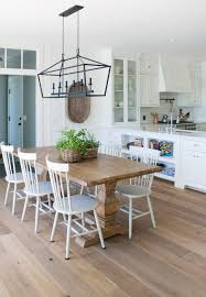 Lake House Dining Room With Wide Plank Oak Flooring White Board And Batten Walls And Rustic Tab Lake House Dining Room Lake House Dining Farmhouse Dining Room