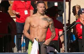 Tokyo — an alligator searching for prey with mouth open and teeth bared lurks in a tattoo on caeleb dressel's left forearm, giving way to a bear inked on his upper arm and an eagle sprawled across his shoulder, chest and back. Caeleb Dressel Ncaas Caeleb Dressel Olympic Swimmers Swimming Tattoo