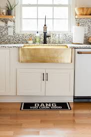 brass sink, white modern kitchen