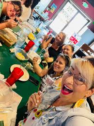 Please identify the lady in the middle and the guy