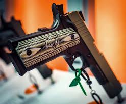 Black And Gold 1911 Grips Want Some Awesome Vzgrips Buy A Taurus 1911 With These Custom Predator Green Grips With The Taurus Logo Guns 1911 Pistol Hand Guns