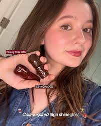 emmakenney wearing our Cola Gloss!🍒🥤 Time for a little Shameless moment  with the bold 70% pigment shade. It's not just stunning