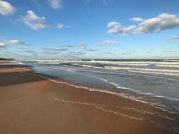 Peaceful Wide Beach With Offshore Sandbar Even At Low Tide