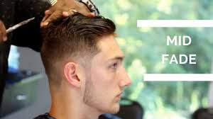 The mid fade haircut has been growing in popularity around the world. Barber Tutorial Mid Fade Haircut With Textured Top Youtube