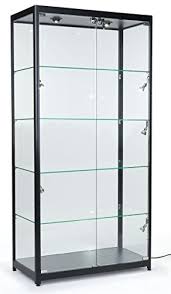 It has three shelves including the bottom one. Displays2go Tempered Glass Curio Cabinet With 8 Halogen Lights 78 X 40 X 16 5 Inch Free Standing Locking Hinged Doors Floor Levelers And 4 Green Edge Glass Shelves Black Aluminum Amazon In Furniture