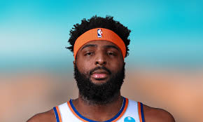 Mitchell Robinson warming up with intention to play Game 4