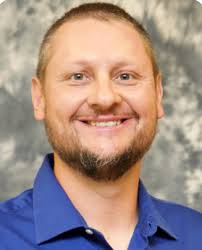 James "Ike" Holzapfel, M.Ed.