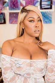 Moriah Mills in a White Sheer Bodysuit