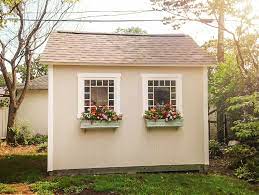The Antique Windows And Custom Window Boxes On This Storage Shed Really Make It Stand Out With Vintage Charm It Lo Garden Shed Lighting Ideas Shed Decor Shed