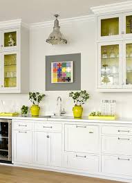 For that masculine appeal apply a bold mustard accent wall in a wooden filled kitchen. Yellow Accents Contemporary Kitchen James R Salomon Photography
