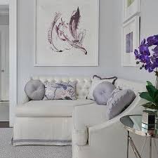 Hang large abstract canvases in shades of purple and lavender as the focal point in the room. Lavender And Purple Striped Walls Design Ideas