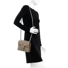 Inspired by the greek god of wine, fertility, theater and ritual madness, dionysus and a myth in which he is said to have crossed this version features beige gg supreme canvas, taupe suede detail and antique silver hardware. Gucci Gg Supreme Monogram Mini Dionysus Shoulder Bag Taupe 210542 Fashionphile