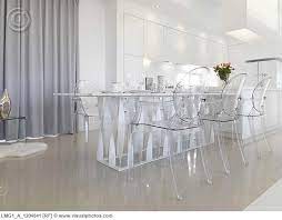 A table at which meals are served; Low Angle Modern Dining Table With Clear Plastic Chairs Love This In A Room With Lots Of Windows And A Modern Dining Table White Plastic Chairs Plastic Chair