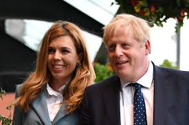 Carrie symonds (c), girlfriend of boris johnson, watches as he gives a speech outside no 10 in july. Carrie Symonds And Boris Johnson Announce Name Of Baby Son
