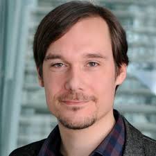 Is a workshop at a conference where people discuss subjects and write  papers more reliable and acceptable than an Internet-based version?