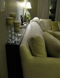 The Couch Table Can Be Very Decorative Give Area For Storage Or Provide A Beneficial Buffer In B Console Table Behind Sofa Sofa Table Decor Narrow Sofa Table