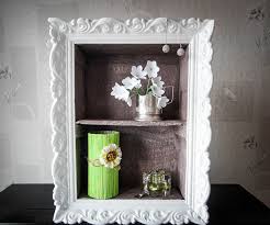 Cut a piece of cardboard into a triangle shape and wrap green yarn or thread around it. Cheap Diy Home Decor Idea Decorative Cardboard Wall Shelf