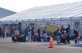 First migrants arrive at NYC's Floyd Bennett Field — only to scoff and  leave isolated site