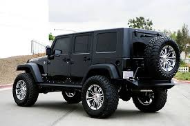 Black 4 Door Jeep Wrangler Rubicon Rear View Of A Jeep Wrangler Unlimited Rubicon With 94r Wheels And Toyo Open Coutry Tires Jeep Cars Dream Cars Dream Cars Jeep