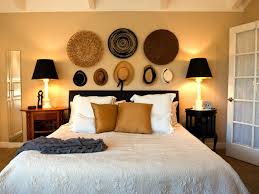 For an extra bit of finish, take your hat hanging to the next level: Cottage Style Bedroom With A Collection Of Straw Hats Hung Above The Bed Hgtv