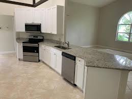 Levven cambria quartz countertop kitchen island dark brown wood cabinets and stainless steel. A A Stone And Cabinet Geschaft Fur Schranke Und Arbeitsflachen Tampa Facebook 122 Fotos