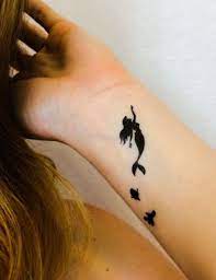 Small and simple little mermaid tattoo designs. 30 Discreet And Utterly Magical Disney Tattoos Disney Inspired Tattoos Tattoos Beautiful Tattoos