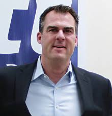 Gov. Stitt's background shapes his governing