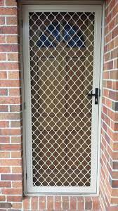 aluminum frame security door with diamond design grille and triple lock installed in cheltenham window grill design steel grill design grill door design