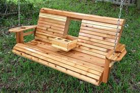 The sturdy wood frame and steel chains can support up to 400 pounds, while the slatted back offers a touch of style. Unwind In Your Yard With A Diy Wood Porch Swing With Cup Holders Your Projects Obn