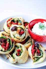 Simple Greek Pinwheels With Tzatziki Dipping Sauce Spinach Roasted Red Peppers Olives And Feta Are Rolled Up In Bu Recipes Food And Drink Appetizer Recipes