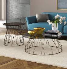 Underneath the glass is a solid wood base that creates a. Coffee Tables With Intertwined Bases Idfdesign
