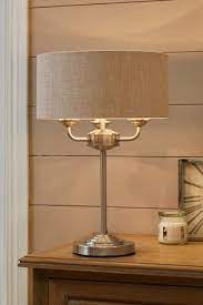 Table lamps come in various sizes, shapes, and styles, which makes them a perfect way to lava lamps are a nostalgic lighting piece that are making a come back for both children and adults alike. Buy Burford 3 Light Table Lamp From The Next Uk Online Shop Table Lamp Lamp Large Table Lamps