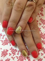 Red nails are so gorgeous and they are the ultimate chameleon. Eye Candy Nails Training Coral Polish With Gold Glitter Ring Finger Over Acrylic Nails By Elaine Moore On 23 May 2013 At 11 02