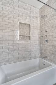 25 beautiful shampoo niches for your beautiful bath products | white marble floral pattern tile niche, designer: Bathtub Shower Combo With Tiled Niche Modern Bathroom New York By Kraftmaster Renovations Houzz